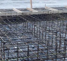Pouring reinforced concrete into formwork molds