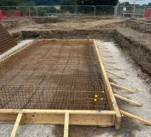 Team inspecting formwork for safety and alignment