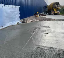 freshly poured concrete being smoothed