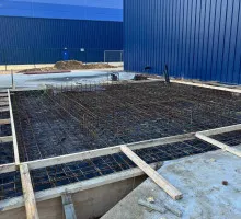 Steel rebar placement in reinforced concrete footing