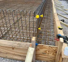 Formwork clamps securing panels before concrete pour