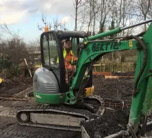 Digger lifting soil