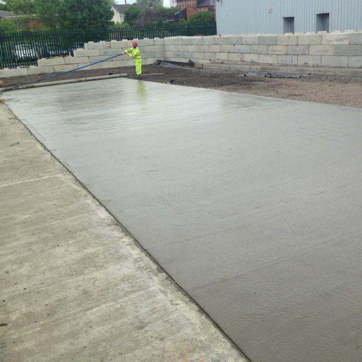 Man leveling concrete